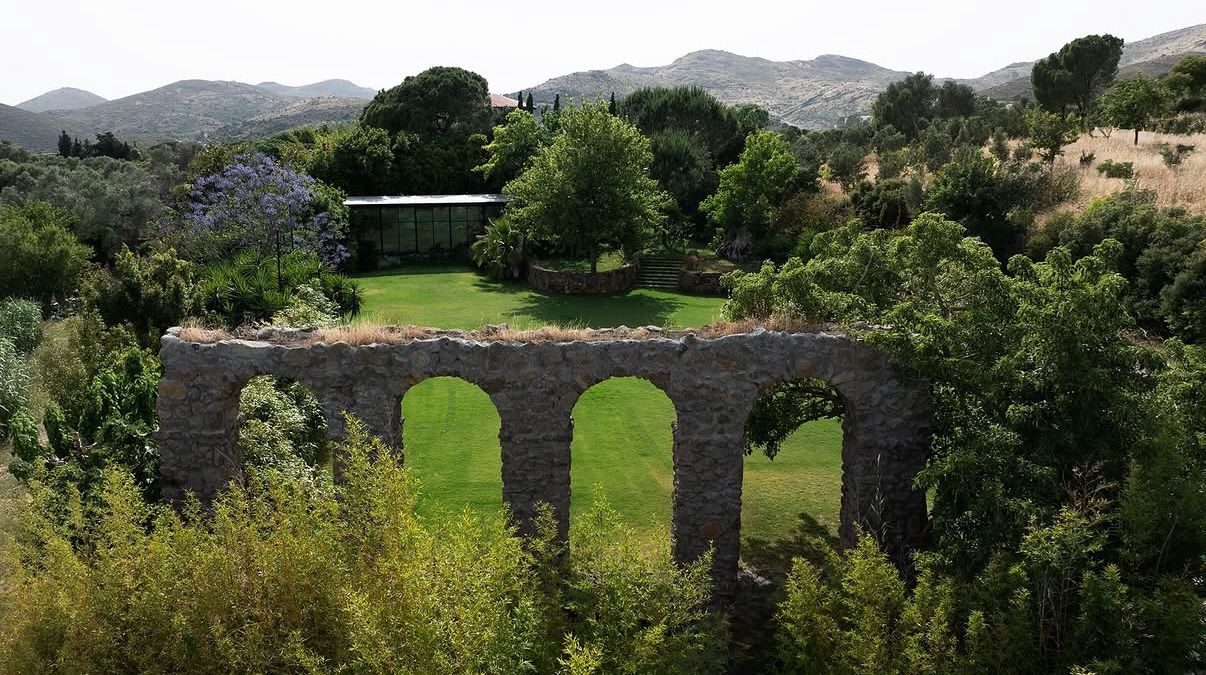 Aerial view of the stone aqueduct over the lawn