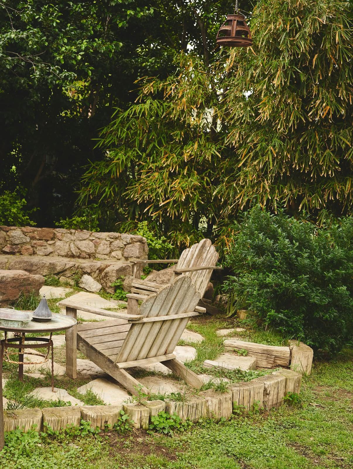 Weathered wooden chairs in the bamboo garden