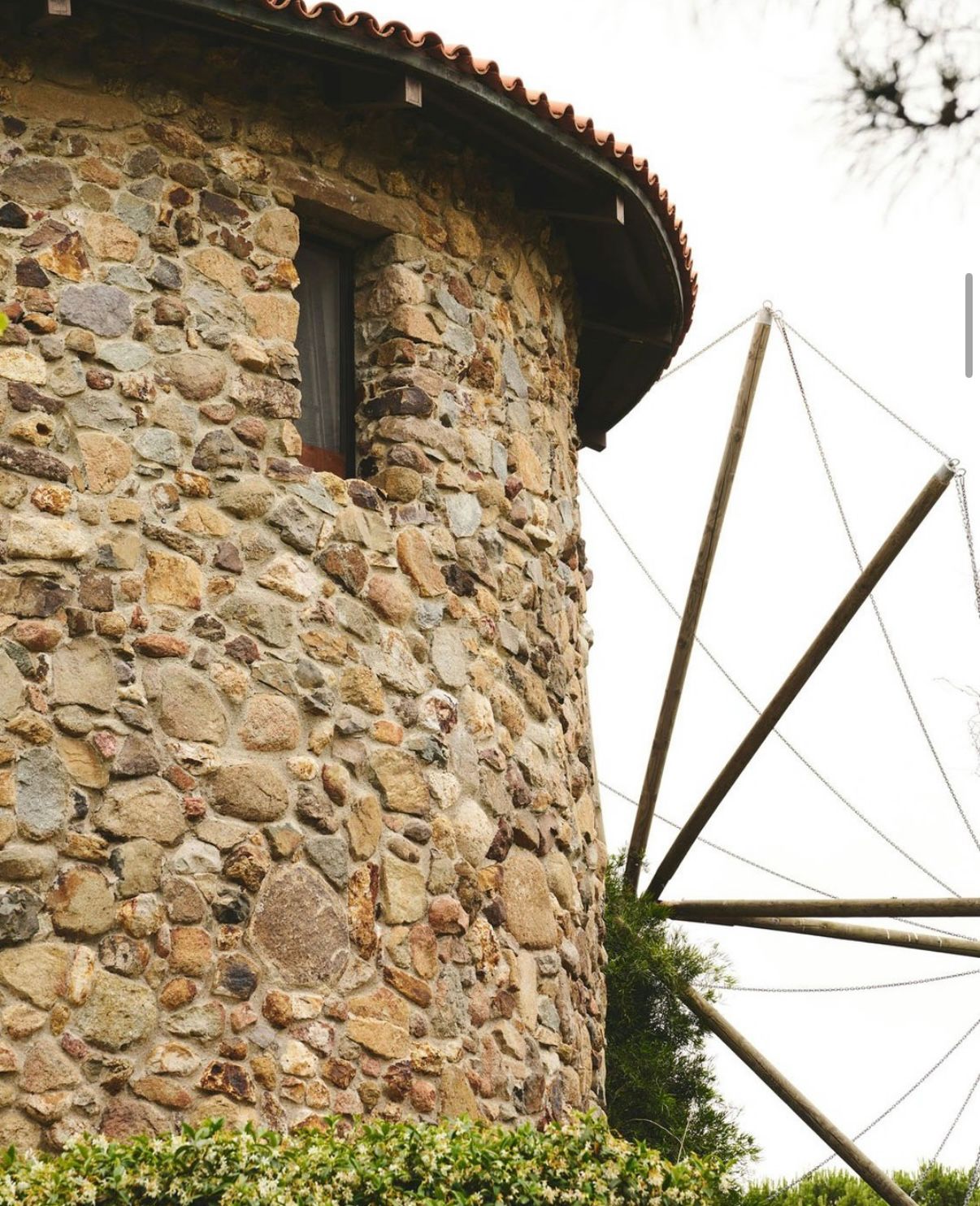 Stone windmill tower with wooden sail
