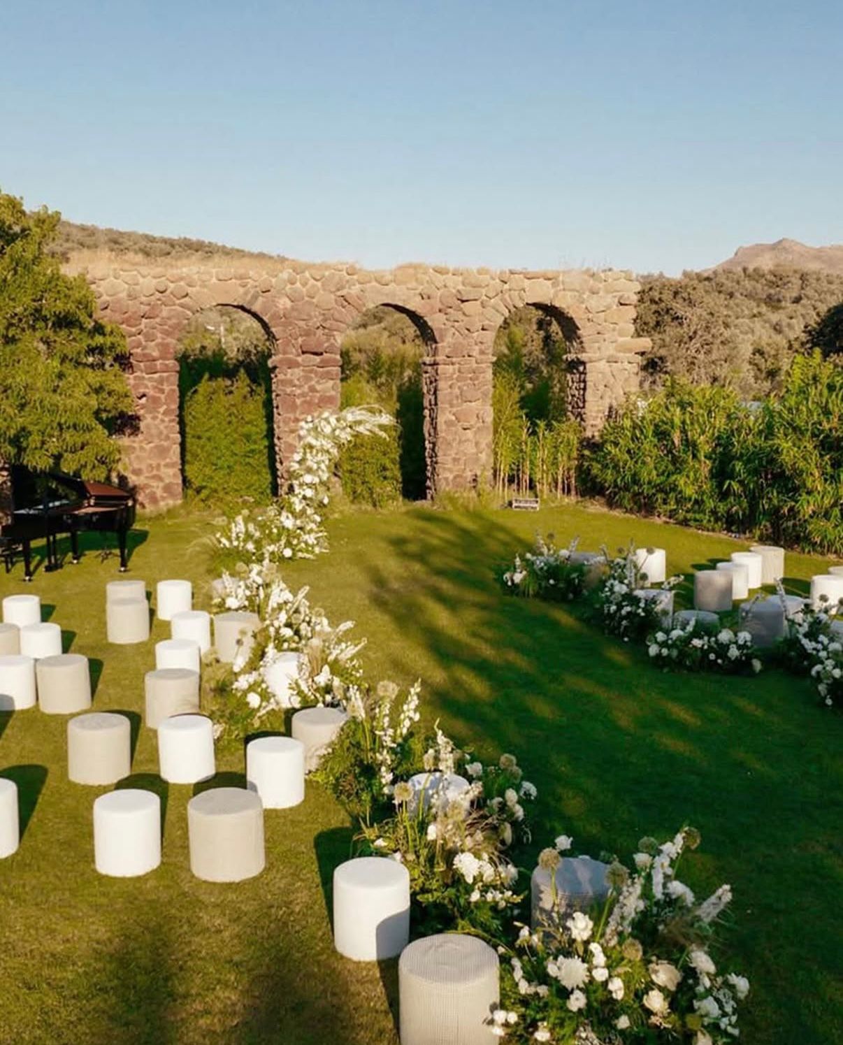 Ceremony beneath the stone aqueduct arches