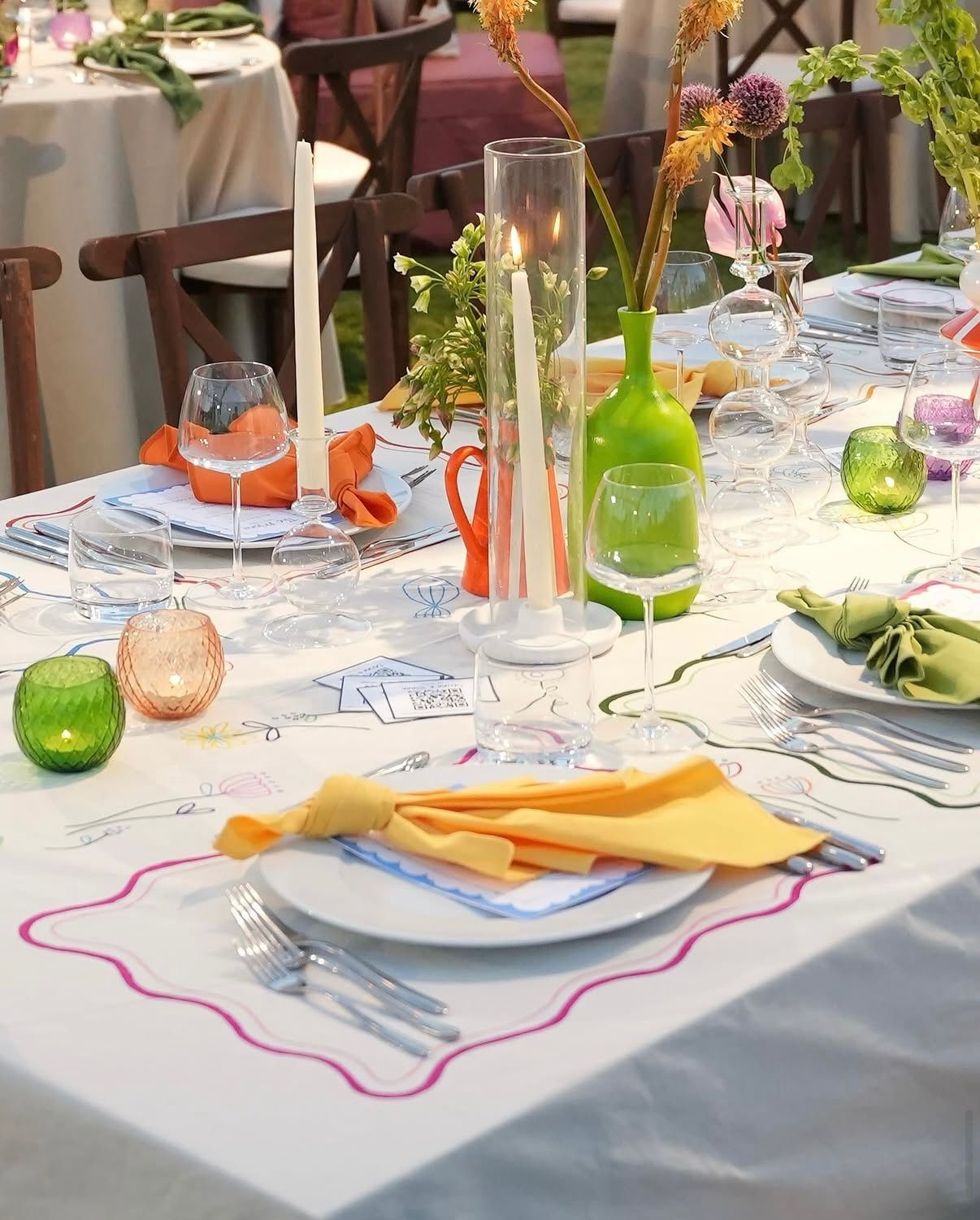 Colorful wedding table setting at dusk